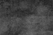 © Andrii_Abriutin - A detailed close-up reveals a weathered, dark gray textured background with subtle variations.