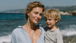 © kora studio - joyful woman holds young boy by beach, with waves crashing in background. Their smiles moment of happiness and connection in sunny coastal setting