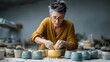 © SnapPik - Woman in Yellow Sweater Creating Pottery