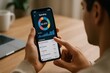 © Татьяна Евдокимова - Close up of hands holding smartphone analyzing monthly spending on personal finance application with charts and graphs