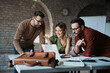 © Novak - Successful business team working at office
