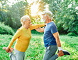 © Lumos sp - Smiling active senior people stretching and exercising together in the park, healthy lifestile workout fitness training class