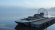 © syukri - airboat docked on a wooden pier in early morning mist.