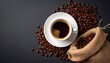 © Nashihal - Top view of Cup of coffee and coffee beans in a sack on dark background