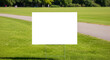 © eexvuu-stock - Blank Yard Sign on Green Lawn Background. Copy Space.