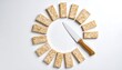 © Lunart - Overhead Shot of Circle of Tempeh Slices with Knife on Clean White Background