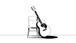 © Mst - Acoustic guitar leaning against a simple chair with a shadow on a white background