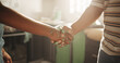 © Lahoud25/peopleimages.com - Agreement, handshake and painting with people in kitchen for deal, maintenance or renovation. Construction, real estate or thank you with homeowner and painter shaking hands for building or success