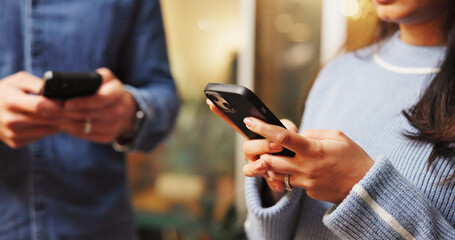 Phone, networking and hands of couple with texting in coffee shop for contact on mobile app. Technology, communication and man with woman on cellphone for online connectivity together in restaurant.