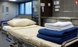 © FocusFusion - Patient bed with thermal blankets, linens, and pillow in the Hospital