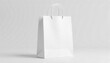 © Halloway - Blank white paper shopping bag on white background. Suitable for branding, advertising, ecommerce, retail concepts, and eco friendly packaging design projects.