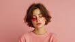 © Daphne - Young caucasian female with pink eye makeup on pink background
