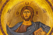 © Travel 'n' Lifestyle - Lefkosia, Cyprus - 25 June 2025: View of a radiant depiction of Jesus Christ, his gaze serene, against a shimmering golden backdrop, halo glowing softly.