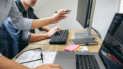 writing codes and typing data code technology, programmer team working on web site project in a soft