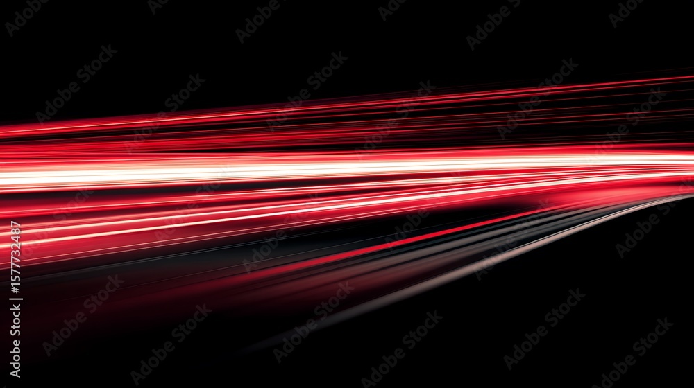 Abstract red light streaks on a dark background creating a sense of ...