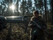 © AImageZ - Armed man aiming with rifle near drone in forest during daylight
