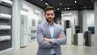 © CStock - Confident sales associate in a modern appliance showroom, ready to assist customers with their buying decisions.