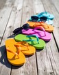 © Dreamera - Sandalias de colores brillantes sobre madera clara, composición veraniega con luz natural y diseño casual, concepto de vacaciones tropicales, playa y descanso relajado