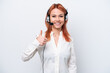 © luismolinero - Telemarketer Russian girl working with a headset isolated on white background giving a thumbs up gesture