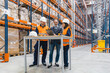 © Koldo_Studio - Warehouse workers and manager are examining inventory checklist in a large distribution warehouse