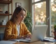 © Andry - Woman working on laptop indoors