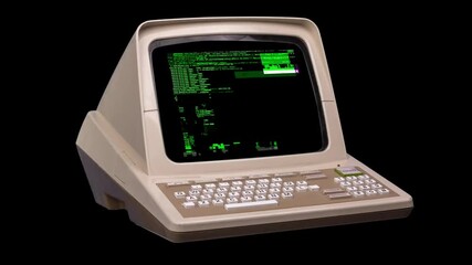 An old-fashioned computer terminal with a green screen and keyboard, used for data input.