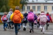 © Gulnaz - A group of children are running down a sidewalk, some of them wearing backpacks