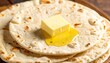 © Berkah3 - Stacked flatbreads topped with melted butter