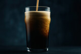 Dark nitro coffee pour creating satiny cascades and creamy wave patterns in pint glass