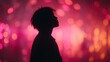 © Chanoknan - Silhouette of a Person Against a Vibrant Colorful Background with Glittering Lights and Bokeh Effect