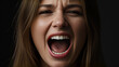 © sabrang - Expressive Woman Yelling with Frustration Against Dark Background | Emotional Outburst