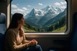 © Татьяна Евдокимова - Woman enjoys a breathtaking view of the Swiss Alps from a train window, surrounded by lush valleys and majestic snow capped peaks