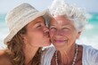 © Serhii - Heartfelt Moments: Senior Mother and Young Daughter Embracing the Joys of Beach Life