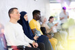 © JackF - Middle-aged man sits on chair in the lobby of the office and waits for an appointment with a specialist
