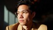 © Lifestyle Images - Close-up portrait of a young asian man wearing round glasses. he is looking directly at the camera with a serious expression on his face.