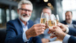 © INT888 - Business people celebrating with glasses of champagne in modern, bright setting, expressing joy and camaraderie during professional gathering or event