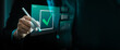 © Sutthiphong - Businessman using digital pen to mark virtual check mark icon on futuristic interface, symbolizing online approval, task completion, data analysis, project management, and workflow automation success