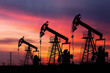 © Zulkifle - An oil pump silhouette stands against a dusk sky of orange and blue, framed by powerline towers and shadowed structures—capturing industrial stillness and energy at sunset.