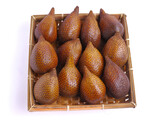 Fresh snakefruit on a bamboo plate isolated on white background, buah salak, salacca zalacca, delicious