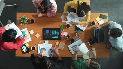 Wall Mural - top view of skilled businessman present marketing idea at meeting while group of investor listening 