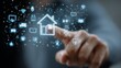© thanarak - Close-up of a hand interacting with a holographic interface showing a smart house and IoT devices — real estate technology innovation