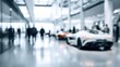 © afterfast - Blurry view of car showroom with people