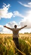 © Berkah4 - Man with arms outstretched in golden field, sunlit sky (1)