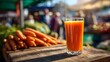 © Shaggy - Human eye level shot of fresh carrot orange juice in a tall glass captured at an outdoor farmers market with vibrant produce stands in the blurred background natural morning light and crisp shadows