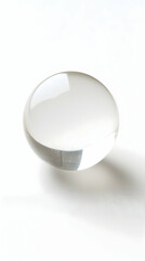 Wall Mural - a clear glass sphere floats on a white background. smooth, perfect surface