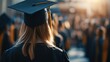 © Alohanongza - A graduate in cap and gown stands among a crowd at an outdoor graduation ceremony, celebrating academic achievement