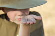 © Austockphoto - Young boy holding a praying mantis he has found