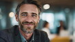 © xuxu - Close-up portrait of a smiling successful businessman of European appearance in a business suit. Concept of success, finance and investment. Confidently looks into the future.