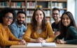 © guo - Group portrait of modern English language teacher and multi-ethnic immigrant students having class in library looking at camera. High quality