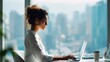 © Muhammad Hammad Zia - Confident Indian and Latin women in office workspace, typing on laptop computers for business learning or remote tasks, modern desk setup with cityscape view and blank banner background